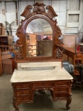 Antique carved maple vanity with marble top (cracked) and ornate carved wood mirror back - as is