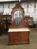 Antique maple carved dresser with marble top and ornate mirrored back - good cond