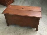 Antique oak flip top storage bench with curved bottom and slight detail