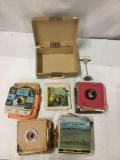 60 + vintage 45s and 7inch...vinyl Records plus small vintage suitcase carrier - see desc