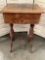 Antique wood sewing table with 2 drawers and key, one leg needs repaired, approx 19x15x30 inches