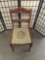 Antique stitched needlepoint seat dining chair with carved ladderback - classic Americana