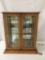 Vintage display case with glass doors and 3 glass shelves, approx 22 x 9 x 26 inches