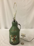 Vintage table lamp with hand painted milk canister base, tested and working, approx 31x10 inches