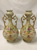 Pair of Antique handpainted bud vases with elegant floral design and dual handles