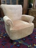 Modern cushioned armchair, unmarked, approx 30x31x34 inches.