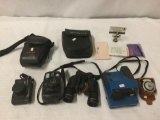 Lot of camera equipment. Konica C35, Pentax Zoom 90-WR, Polaroid Impulse AF, Bushnell Sportview