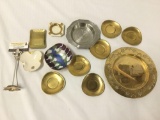 Lot of 12 ashtrays/plates. Brass, China, metal and more. The largest piece measures approximately