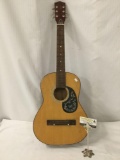 Vintage acoustic guitar with steel reinforced neck and butterfly design, approx 13 x 36 x 4 inches