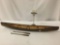 Vintage model canoe having interior ribs, painted geometric design & a pair of paddles