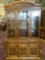 Modern Pecan china cabinet with glass windows/shelves, lighted top - marked Laconia