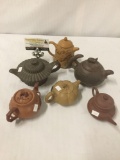 Collection of 6 ceramic Chinese teapots w/ various designs - see pics