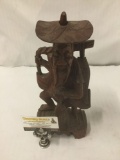 Chinese hand carved wood figural statue of laughing old man with fish. Signed by Artist