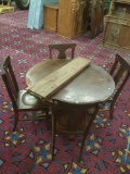Antique round mission style dining table with 4 chairs and 3 leaves that need refinishing