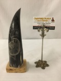 Animal horn mounted on wood base with carved lion design