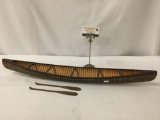 Vintage model canoe having interior ribs, painted geometric design & a pair of paddles