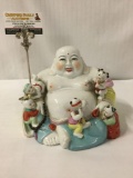 Porcelain Buddha statue with painted accents , Buddha story teller