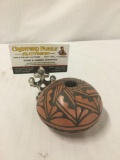 Ceramic seed pot with geometric designs by T. Sando of Jemez, New Mexico