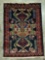 Hand made Native American small wool rug with vibrant design