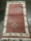 Thick wool rug with fringe, natural tones with geometric and floral designs