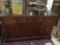 Vintage glass top 60's buffet sideboard with mahogany finish and clean design