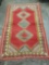 Patterned vintage rug with red hues - classic Iran design, in good condition