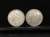 Collection of 2 silver Morgan Dollar coins. The dates included are 1899-O and 1889