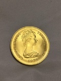 Royal Canadian mint 1975 100 dollar gold proof coin of the Cayman Islands. Weighs 22.50g