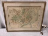 Professionally framed tinted map of mainland China drawn and engraved by J. Bartholomew