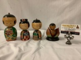 Set of four painted Japanese wooden dolls circa 1952