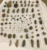 A variety of primitive tools, crystals, fossils, geodes, and assorted stones