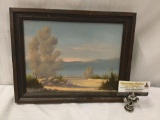 Original oil painting by W.K. Peterson depicting a desert landscape in wood frame