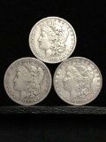 Collection of 3 silver Morgan Dollars. The years are 1900 1882-O and 1883