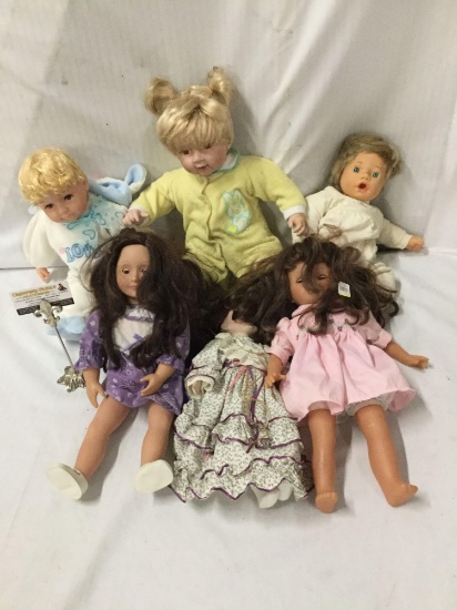 6x vinyl and porcelain baby Dolls. Cathay and more. Largest doll measures approximately 17x13x8
