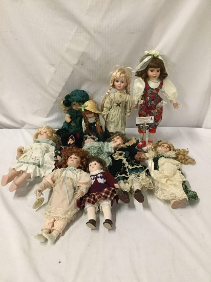 11x vintage porcelain dolls. The largest measures approximately 18x8x5 inches.