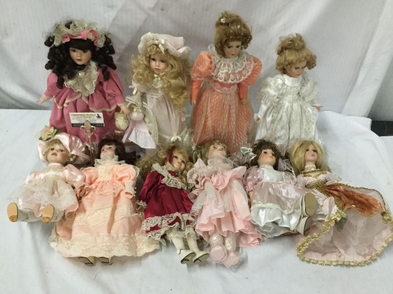 10x Porcelain Dolls. Broadway Olle toon and kore. Largest doll Measures approximately 19x8x5 inches.