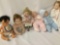 Six vinyl and porcelain baby dolls from makers like Boots Tyner and Furga, largest doll measures