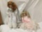 2 large porcelain dolls. Danbury Mint and unmarked. Largest doll measures approximately 31x12x8