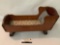 Antique wooden Keystone, Boston doll cradle bed rocker w/ wind up music box, approximately 18 x 9 x