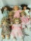 Seven porcelain and vinyl dolls from Susan Wakeen Doll Co, ZAPF Creation, and Gi-Go Toys. Approx