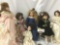 Six porcelain and composite dolls from makers like the Curie Collection. Largest doll approx. 8x20x4