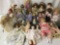 Twenty-five porcelain, ceramic, and vinyl dolls from makers like Seymour Mann, Dandee, Crowne,