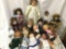 Seventeen porcelain, cloth, and vinyl dolls from makers like Showstoppers, Heritage Mint, Alexander,