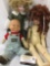 Three vintage porcelain and soft vinyl dolls from Osh Kosh BGosh and others. Largest doll is