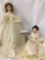 Two large composite and porcelain dolls in wedding dresses. Larger doll measures approximately