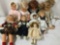 Nine soft vinyl and porcelain dolls from makers like Famosa, Zapf, and Bradley Dolls. Largest doll