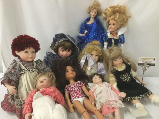 Nine porcelain, vinyl, and composite dolls from makers like Mattel, House of Roses, MGA