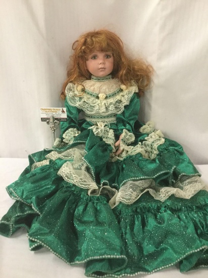 Large MBI porcelain doll with flowing green dress. The doll measures approximately 28x16x9 inches.