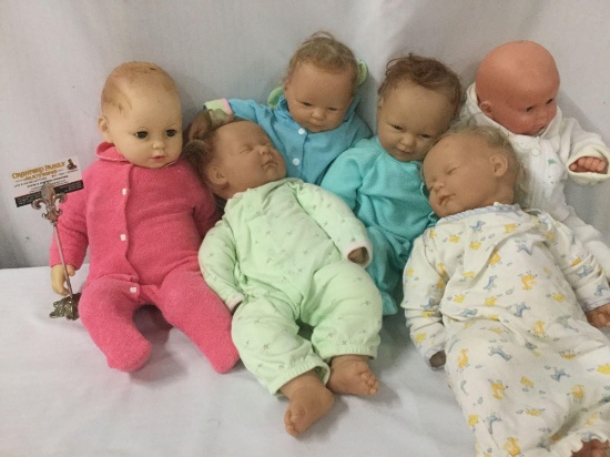 Six vinyl and composite baby dolls from makers like World Doll and Berenguer. Largest doll approx.