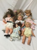 8x vinyl and porcelain dolls. Emerald collection and more. Largest doll measures approximately